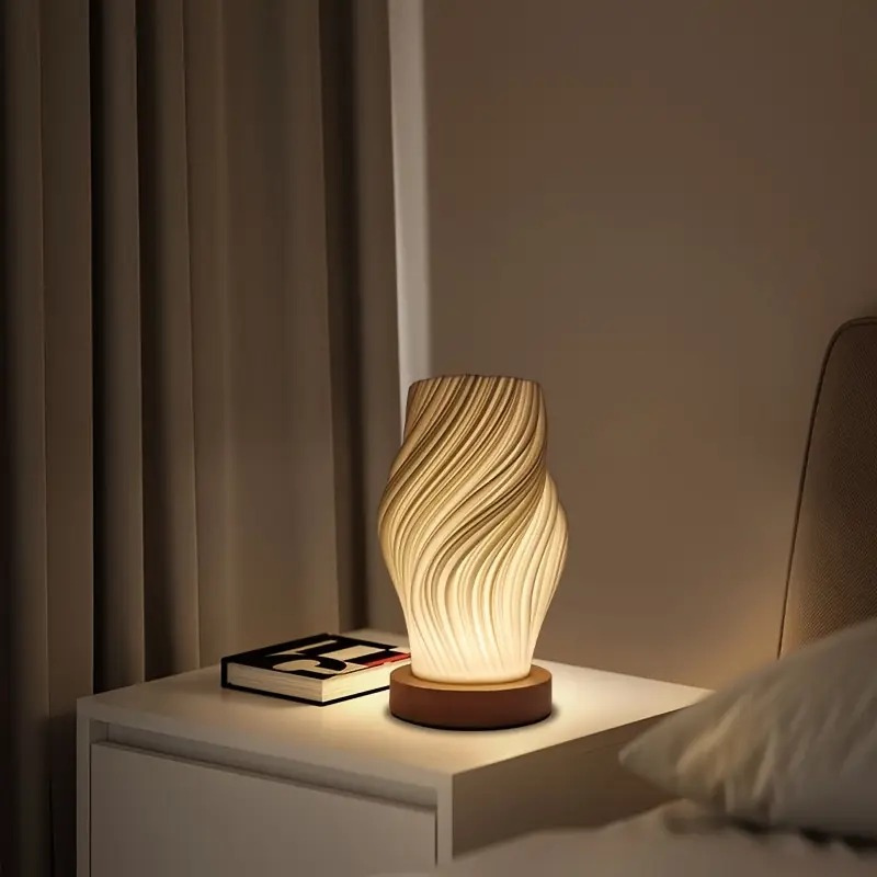 Cremefarbene moderne LED-Tischleuchte mit Metallfuß und 3D-Wellendesign