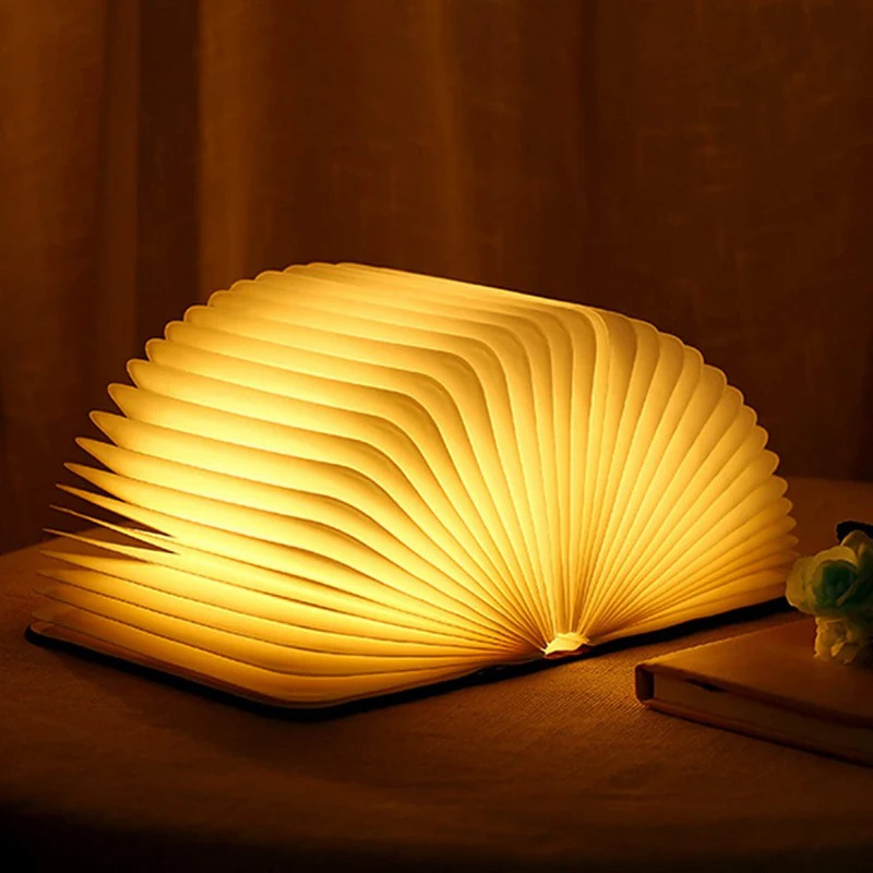 Mystische LED-Lampe in Buchform, faltbares Design mit warmem Licht, tragbar und wiederaufladbar für Schlafzimmer oder Arbeitszimmer.